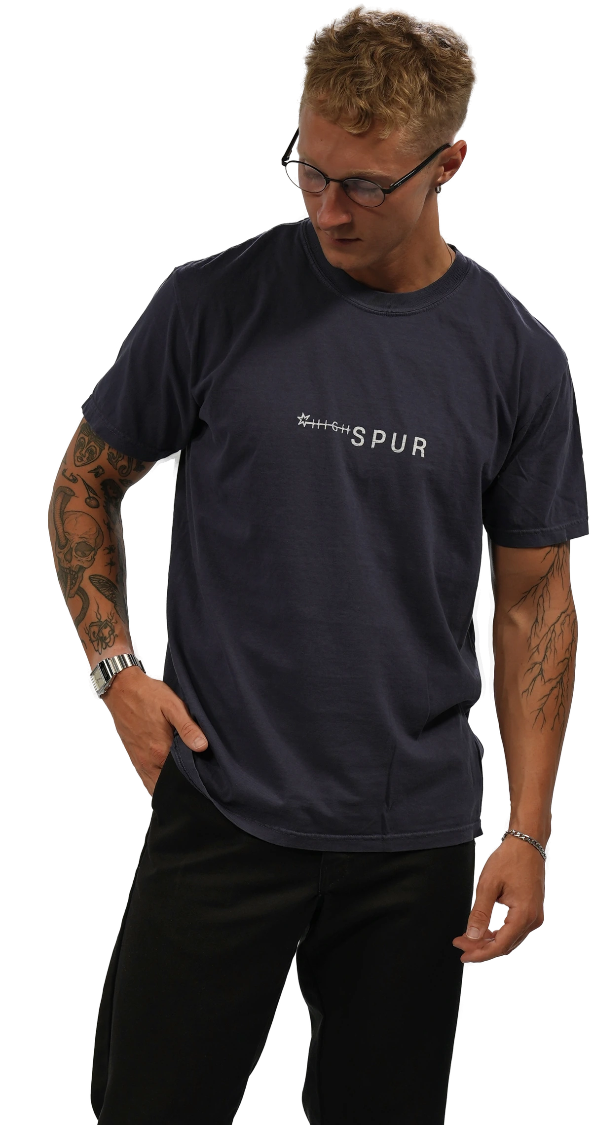 Benton, HIGHSPUR founder and perfumer, wearing the navy HIGHSPUR tee.